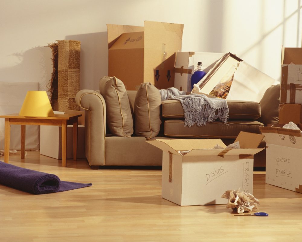 Unpacked moving boxes in Living Room